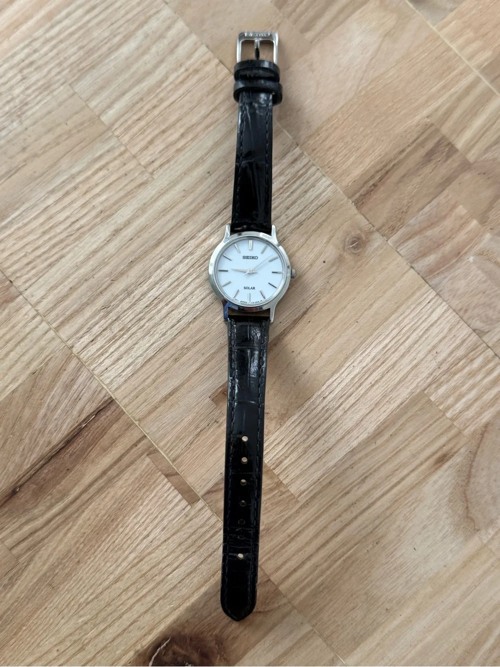 Seiko Solar Ladies Watch White Round Dial Black Leather Strap Stainless Case